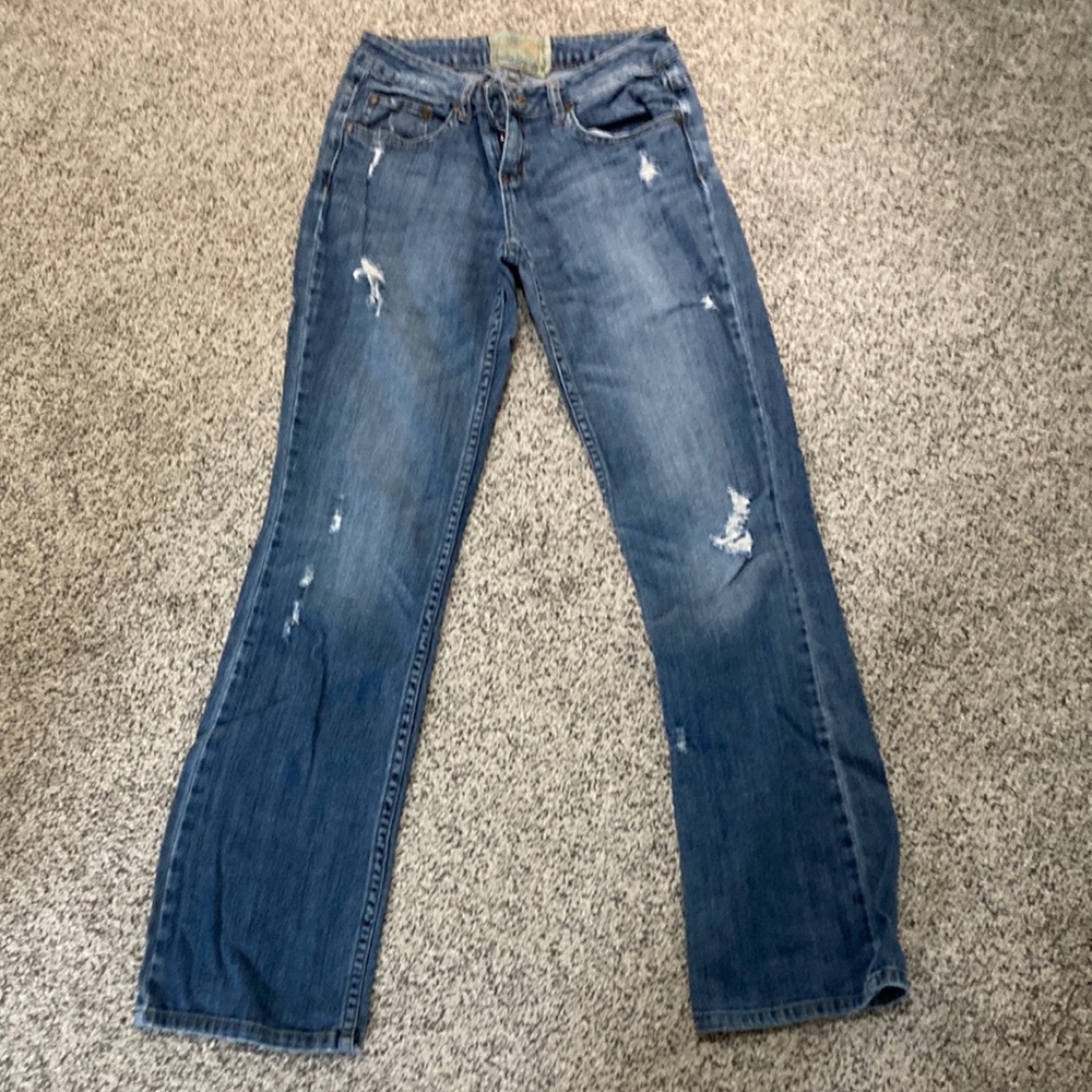 Distressed boot cut jeans